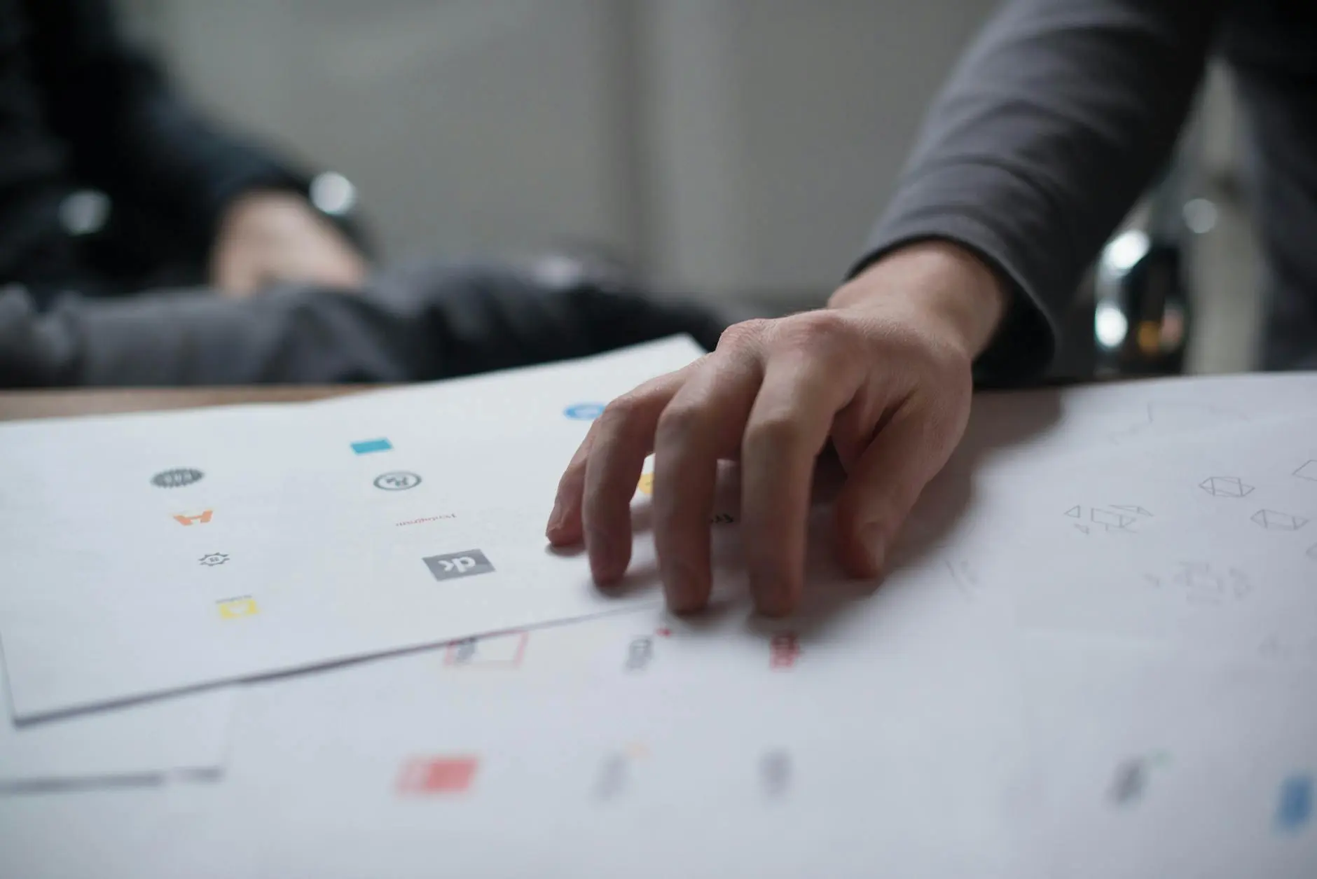 hand on top of paper