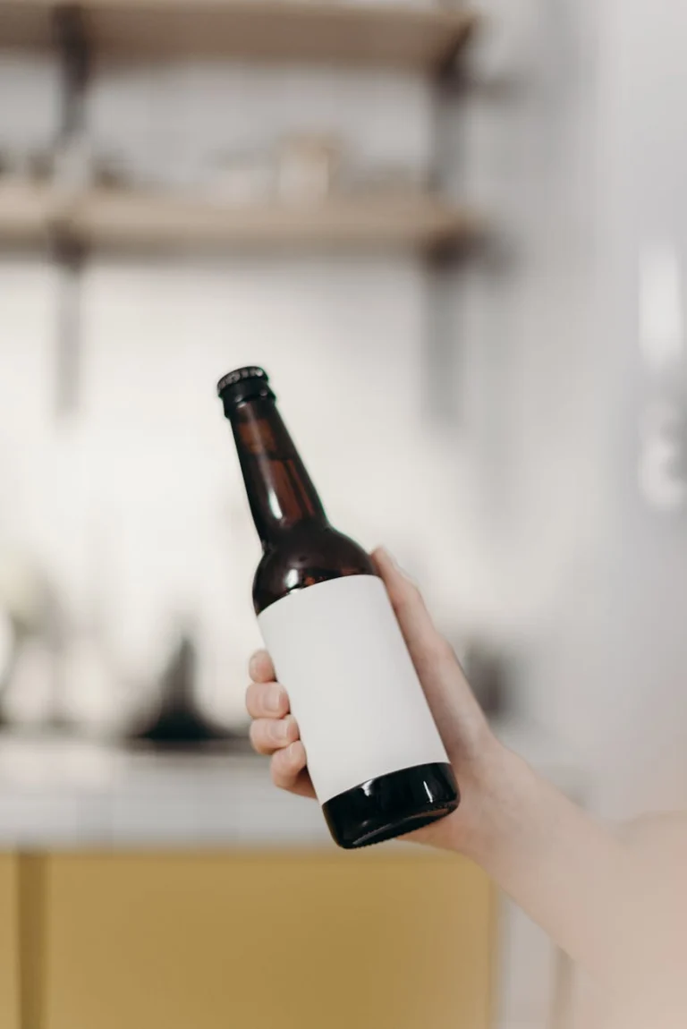 person holding white labeled bottle